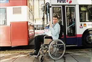 DDS Group member poses by buses